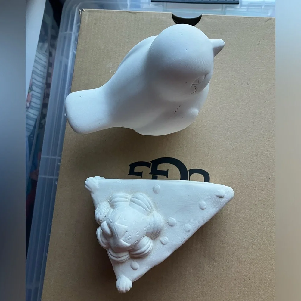 Unpainted bisque ceramic unfinished bird and strawberry cake figurines pottery